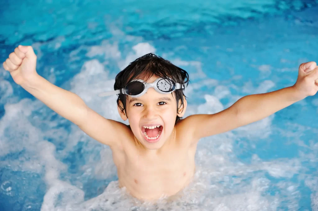 child swimming in a pool